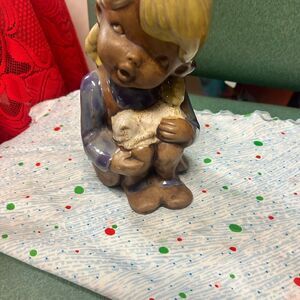 Nbn Cermaic doll holding a cat